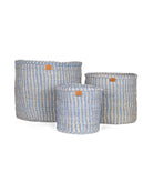 Three woven baskets with blue and white pinstripe on a white background